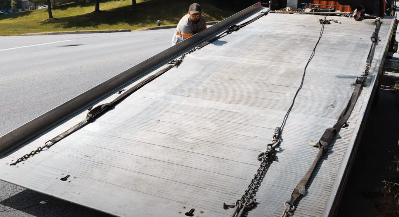 Flatbed towing service safely transporting vehicles in Cerritos, CA